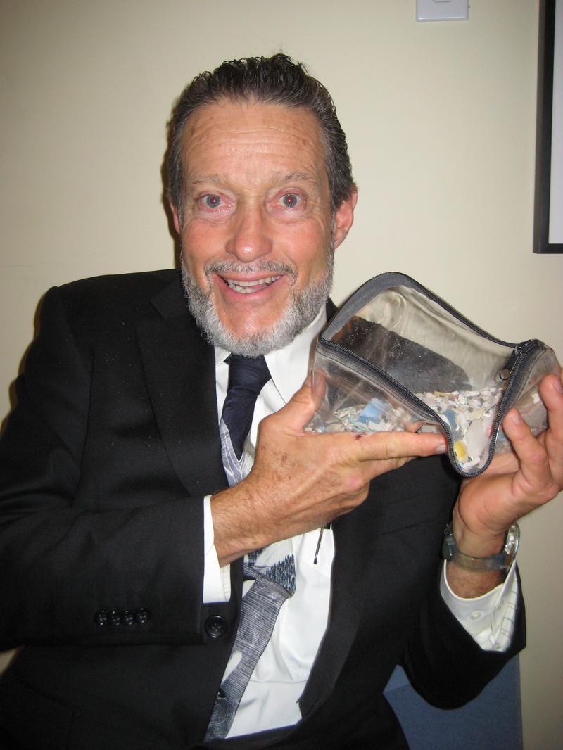 Captain Moore and his plastic sand sample